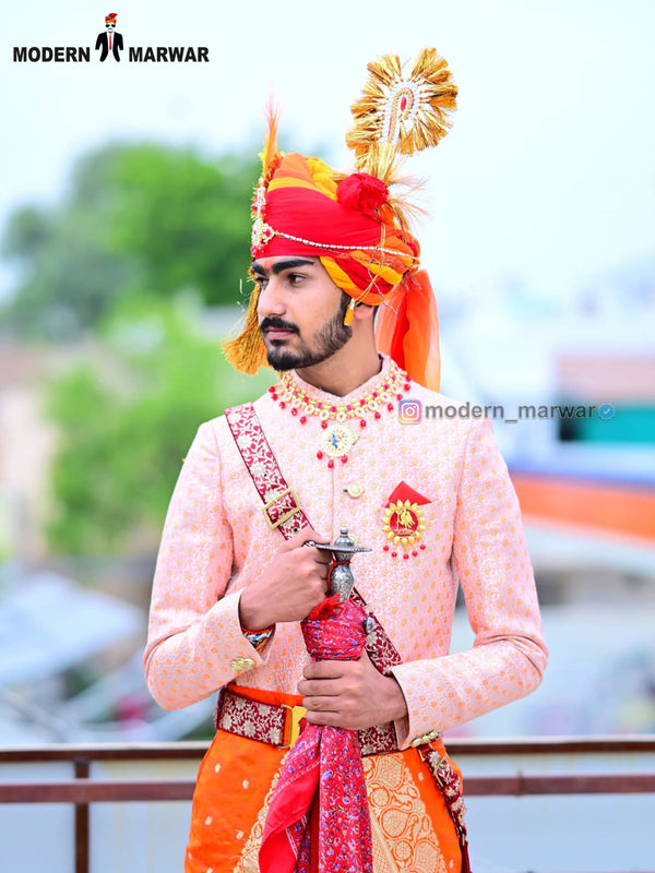 Elegant wedding groom sherwani in peach with intricate embroidery and traditional accessories