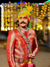 Stunning wedding groom sherwani in red with intricate patterns and traditional accessories for a festive look