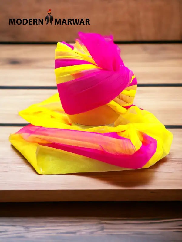 Multicolor wedding turban in vibrant pink and yellow hues from Modern Marwar, perfect for celebrations