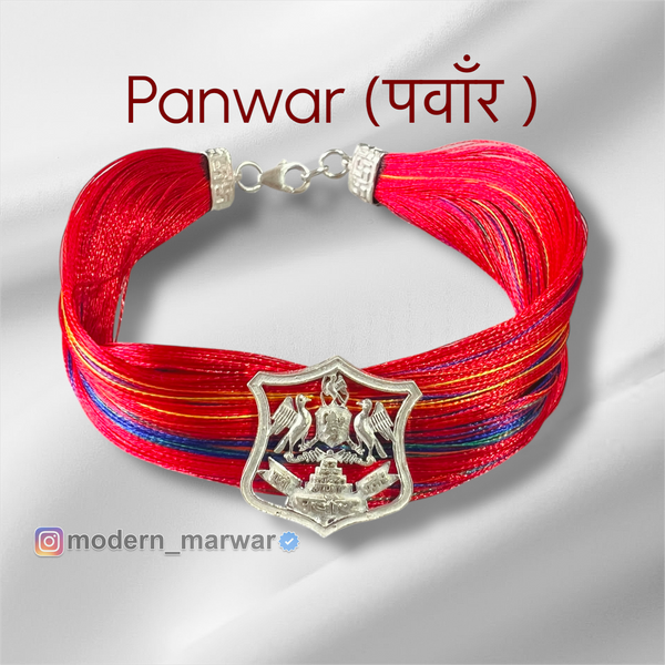 Panwar logo moli bracelet with vibrant red threads and silver emblem for stylish accessories