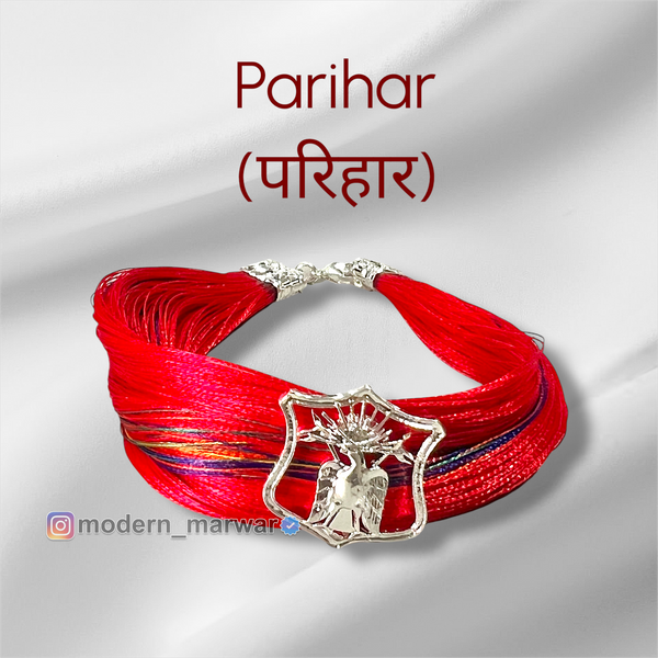 Parihar logo moli bracelet in vibrant red with a decorative emblem for stylish accessories