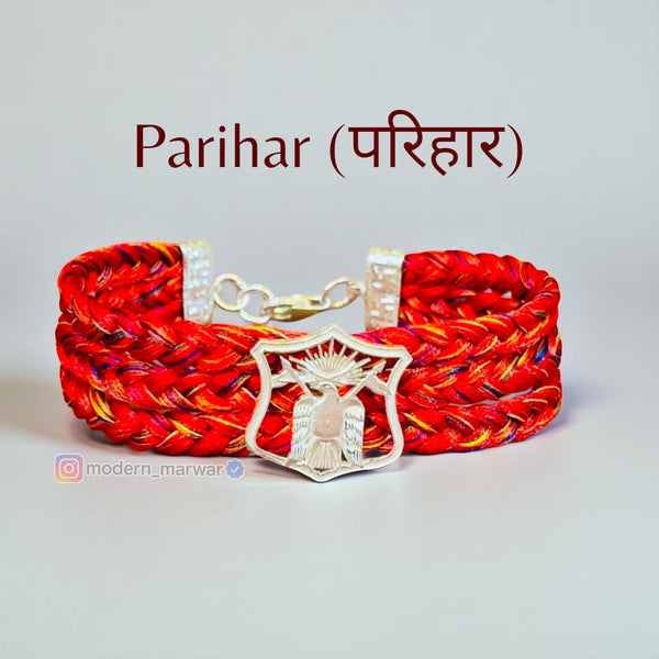 Parihar logo moli bracelet in vibrant red with a silver eagle emblem for stylish accessories