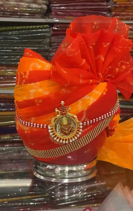 Vibrant Rajasthani safa for groom adorned with intricate embellishments and elegant colors