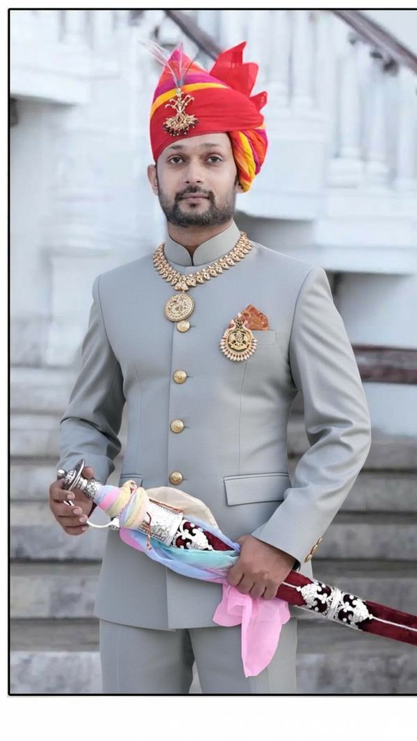 Elegant Rajputi Jodhpuri Suit for men with intricate buttons and a matching turban, ideal for royal events