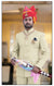 Elegant Rajputi Jodhpuri Suit for men, featuring a traditional design with vibrant accessories and a regal appearance