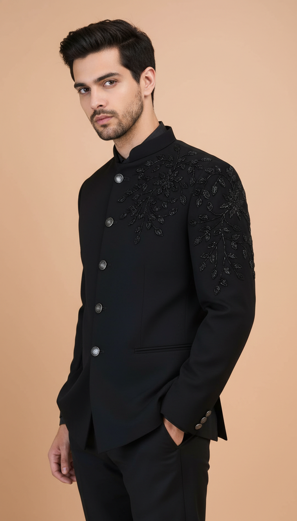 Stylish black royal bandhgala suit for men with intricate embroidery on one shoulder