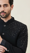 Elegant black royal bandhgala suit for men with intricate floral embroidery details