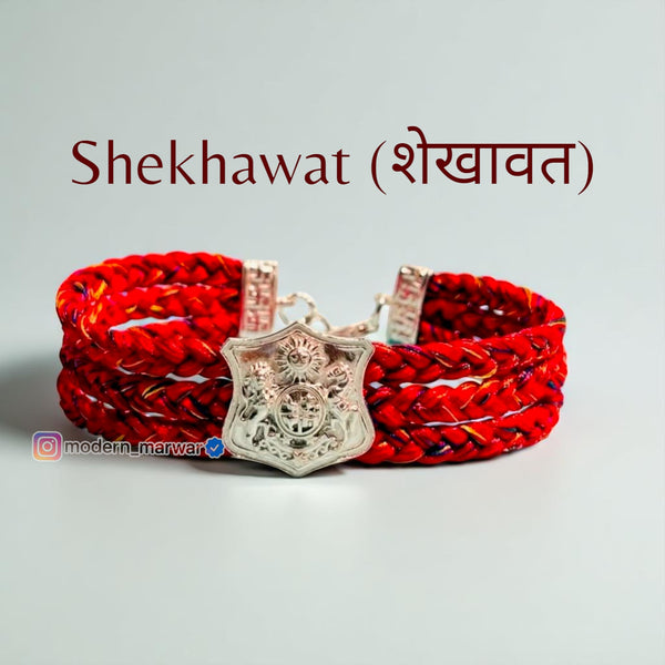 Shekhawat moli bracelet in red with intricate design and silver decorative element