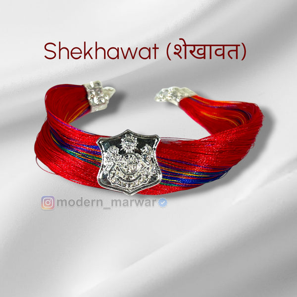 Red Shekhawat moli bracelet featuring intricate silver detailing and traditional design