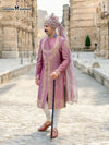 Model wearing a pink Sherwani Angarkha traditional wear with intricate embroidery and a stylish turban