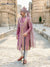 Model wearing a pink Sherwani Angarkha traditional wear with intricate embroidery and a stylish turban
