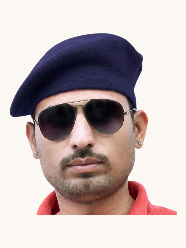 Default navy wool beret cap online, worn at an angle by a man with sunglasses