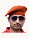 Default Orange Wool Beret Cap Online worn at an angle with sunglasses