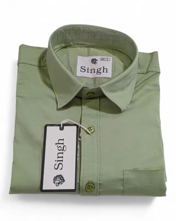 Folded men's green dress shirt by Modern Marwar with a classic collar and button details