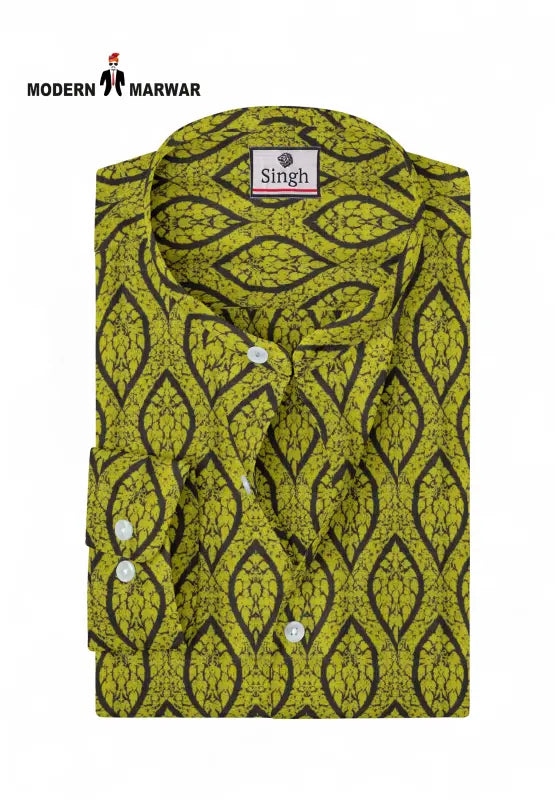 Singh men's printed kurta in green with black leaf pattern and white buttons folded neatly