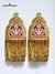 Traditional epaulette accessories in gold and red with intricate embroidery and tassels