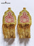 Elegant traditional epaulette accessory in gold and red with intricate designs for ceremonial attire