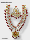 Elegant traditional Indian necklace set with intricate designs and red embellishments for special occasions