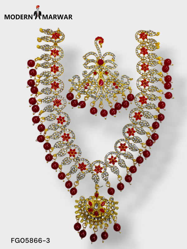 Elegant traditional Indian necklace set with intricate designs and red embellishments for special occasions