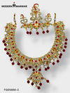 Traditional Indian necklace set with intricate gold design and red stone embellishments from Modern Marwar