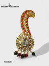Traditional peacock brooch from Modern Marwar with colorful embellishments and intricate stone designs