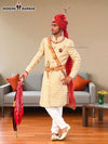 Elegant wedding groom sherwani in cream with intricate embroidery and royal accessories