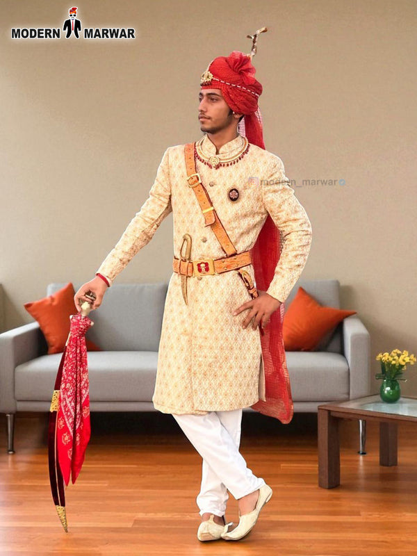 Elegant wedding groom sherwani in cream with intricate embroidery and royal accessories