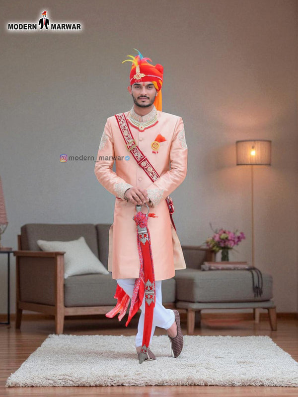 Elegant wedding groom sherwani in peach with intricate embroidery and traditional accessories