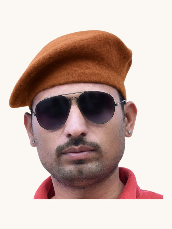 Default brown felt beret cap online worn at a slight angle by a man with sunglasses