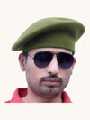 Default green wool beret cap online worn by a man with sunglasses
