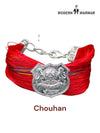 Default red fabric bracelet viewed from the side featuring the Chouhan logo bracelet and moli