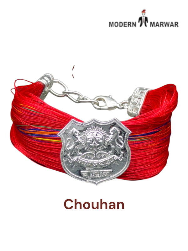 Default red fabric bracelet viewed from the side featuring the Chouhan logo bracelet and moli