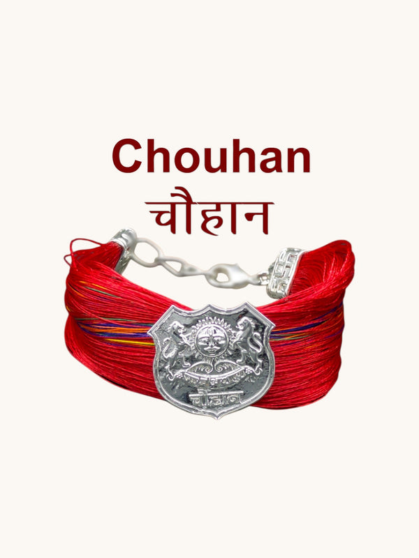 Chouhan logo bracelet and moli featuring colorful threads and a decorative shield emblem