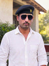 Default Coffee Beret Cap Solanki Lobo in black fabric worn by a model outdoors