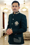 Stylish MODERN MARWAR designer men’s coat suit in dark green with embroidered details and pocket design