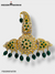 Traditional Indian wedding jewelry featuring intricate gold design with green gemstones and pearl accents