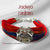 Jadeja logo moli bracelet with vibrant red and blue threads, featuring a decorative centerpiece