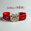 Red braided bracelet featuring the Jadeja logo moli bracelet with intricate silver detailing