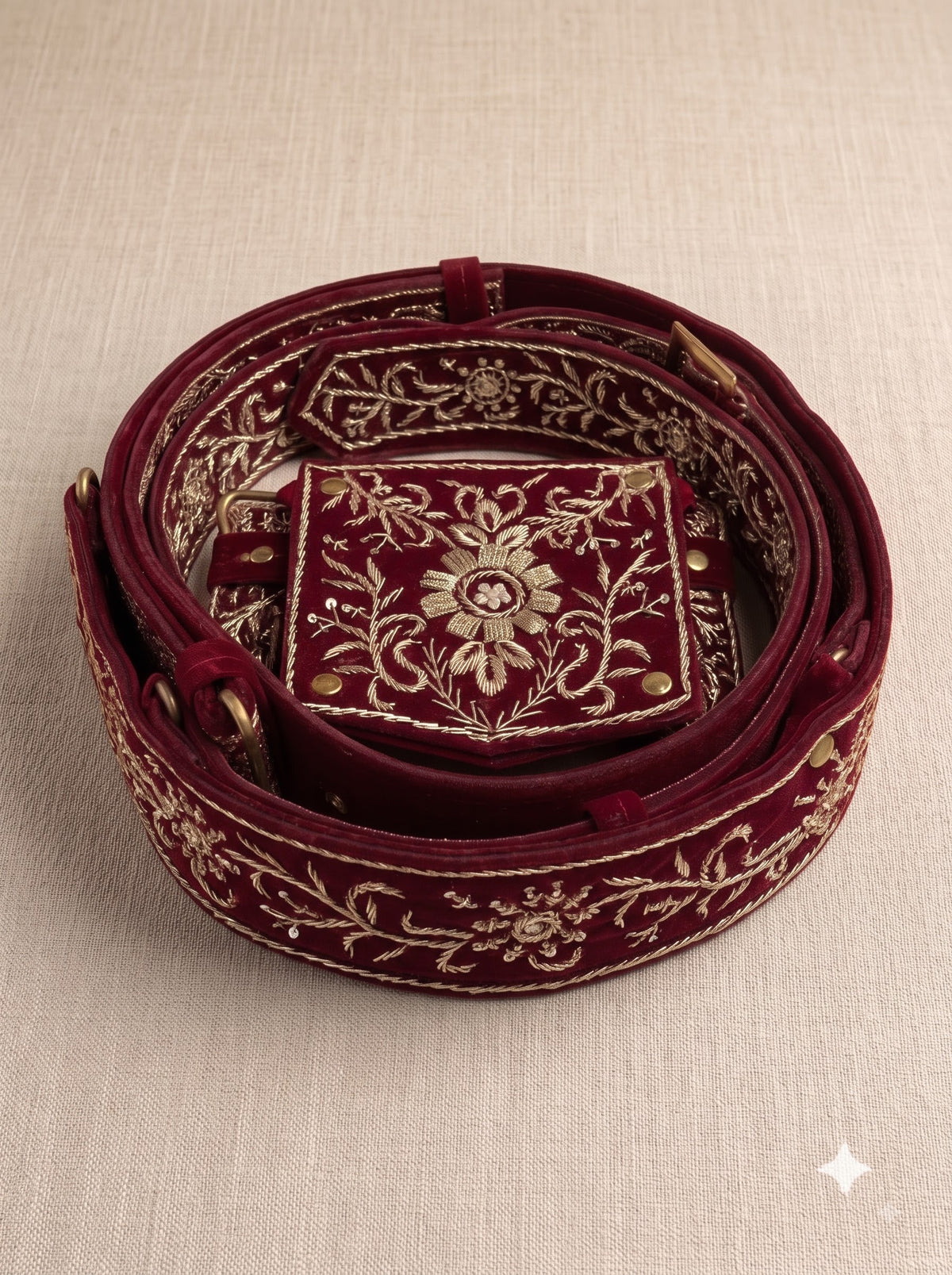 Embroidered burgundy velvet belt shown from above, featuring JARDOJI BELT-5600 design details
