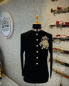 Elegant black Jodhpuri suit featuring an elephant logo Jodhpuri suit design with ornate details