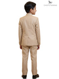 Kids Jodhpuri Suit in Beige Fabric from Chotte Banna, shown from a back angle, model wearing suit