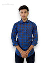 Singh men's blue checked casual shirt modeled by a man with rolled-up sleeves
