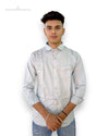 Men's printed formal shirt by SINGH in light color with subtle patterns worn by male model