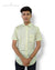 Singh men's printed short sleeve shirt in light yellow with subtle pattern worn by male model