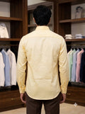 Men's yellow cotton shirt from SINGH, shown from the back in a stylish setting, perfect for casual wear