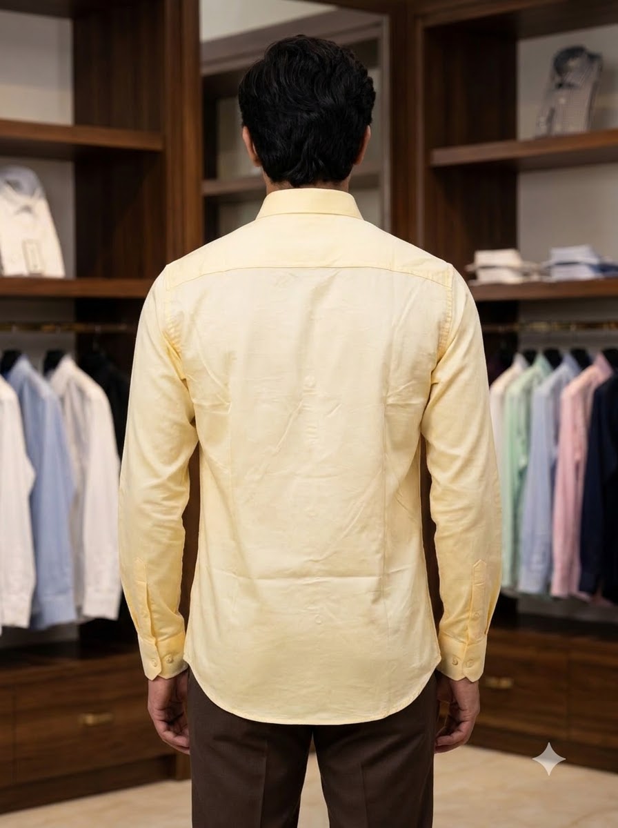 Men's yellow cotton shirt from SINGH, shown from the back in a stylish setting, perfect for casual wear