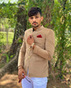 Stylish men's wedding coat suit in beige with elegant detailing and a pocket square for formal occasions