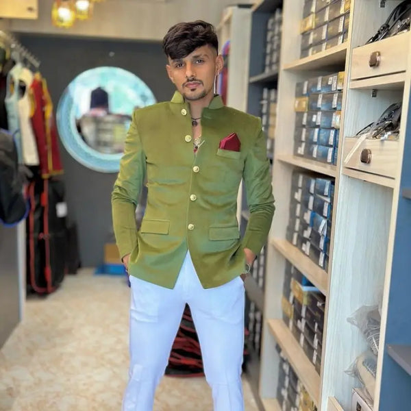 Stylish men's wedding coat suit in olive green with gold buttons and a coordinating pocket square