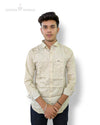 Singh men's formal shirt beige with subtle pattern worn by a young man with folded sleeves