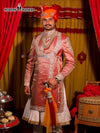 Elegant Modern Marwar designer angarkha sherwani for men in pink with intricate detailing and royal accessories